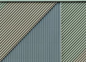 Close-up of a diagonal patterned metal wall with a unique texture design.